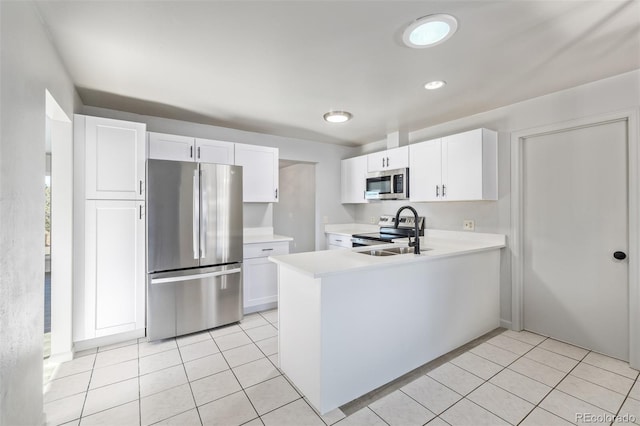 kitchen featuring sink, white cabinetry, and stainless steel appliances