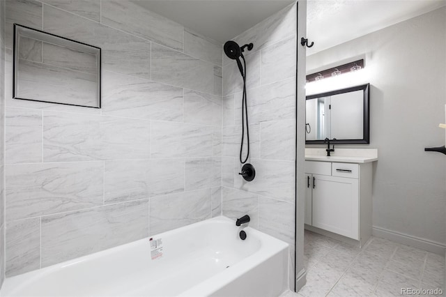 bathroom featuring vanity and tiled shower / bath combo