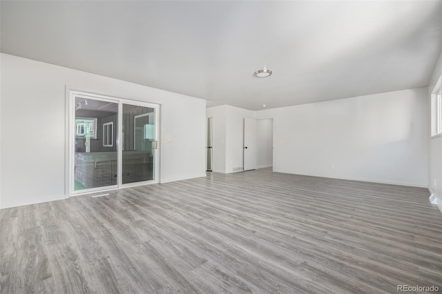 empty room with light hardwood / wood-style floors