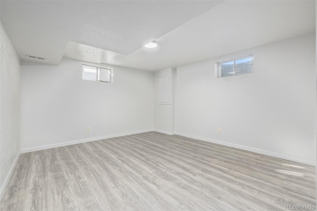 basement with light wood-type flooring