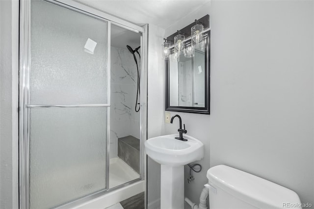 bathroom with toilet and walk in shower