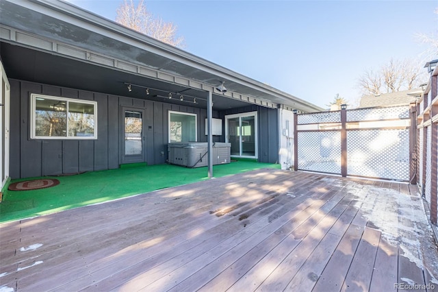 deck featuring a hot tub