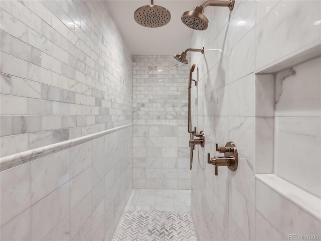 bathroom with tiled shower