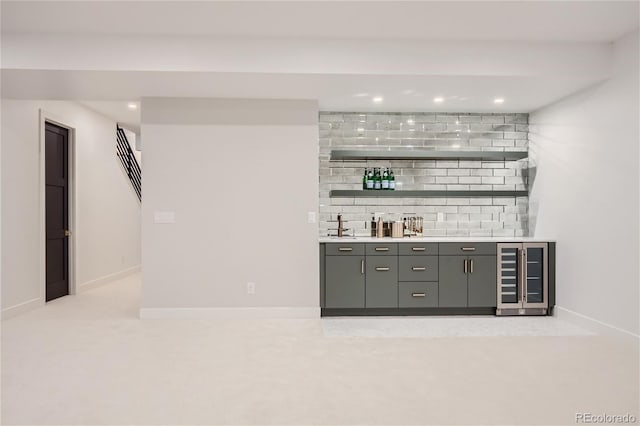 bar featuring tasteful backsplash, light carpet, and beverage cooler