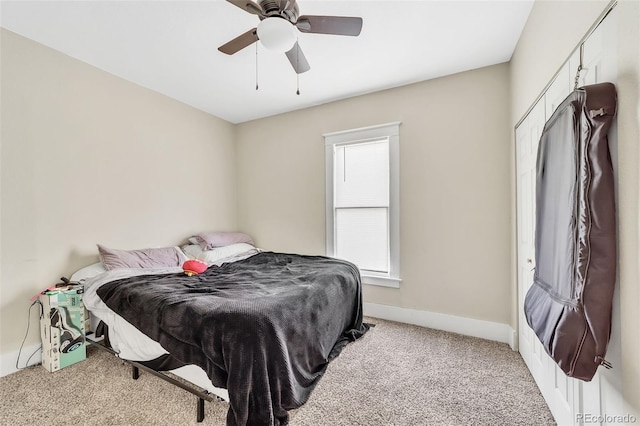 bedroom featuring baseboards, carpet, and a ceiling fan