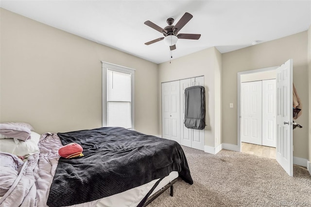 carpeted bedroom featuring a closet, ceiling fan, and baseboards