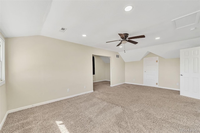 carpeted empty room with lofted ceiling, recessed lighting, visible vents, and baseboards