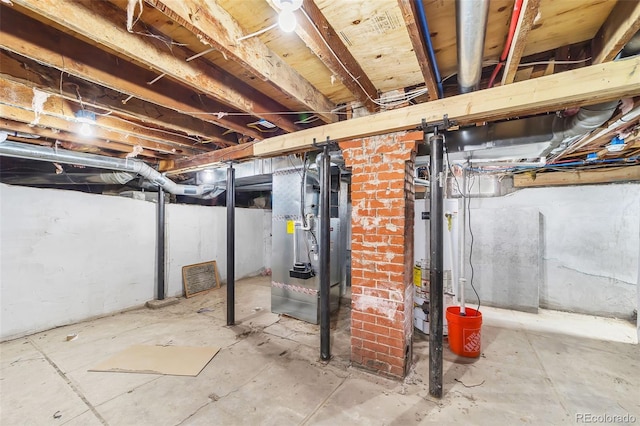 unfinished basement featuring gas water heater