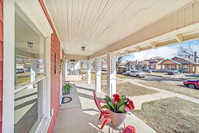 view of patio / terrace featuring a residential view and covered porch