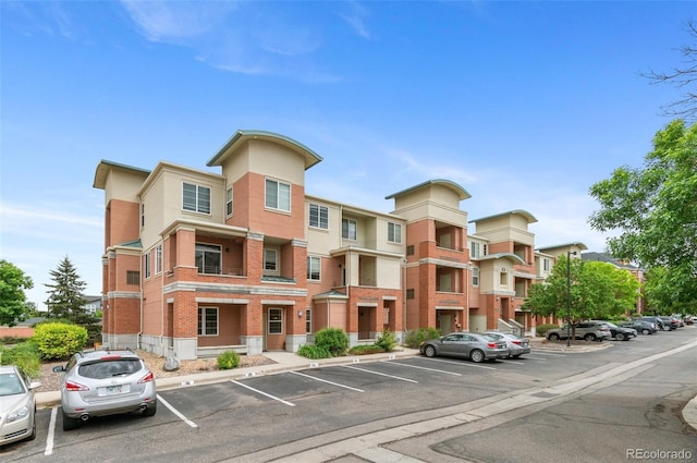 4100 Albion St Unit 614, Denver, CO 80216 - view of apartment building / complex with uncovered parking