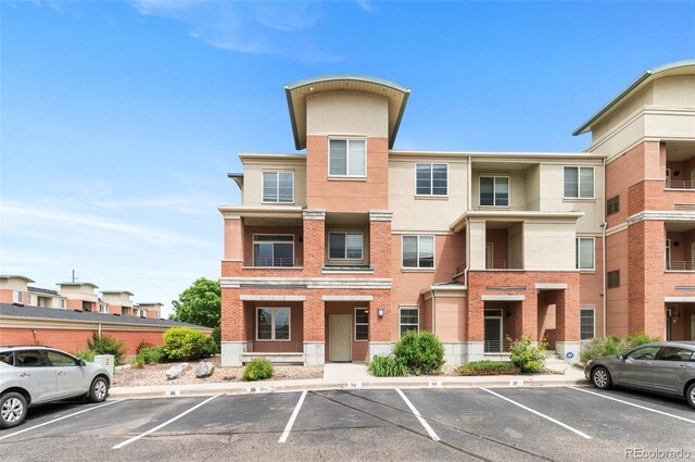 4100 Albion St Unit 614, Denver, CO 80216 - view of property featuring uncovered parking