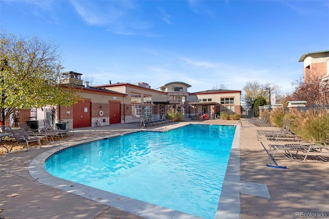 4100 Albion St Unit 614, Denver, CO 80216 - community pool featuring a patio area