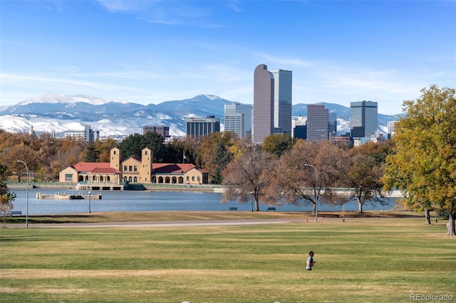 4100 Albion St Unit 614, Denver, CO 80216 - view of property's community with a yard and a water and mountain view