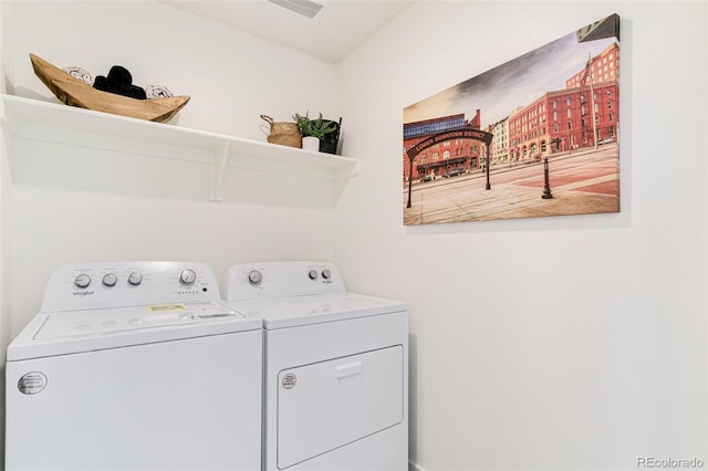 clothes washing area with washer and dryer