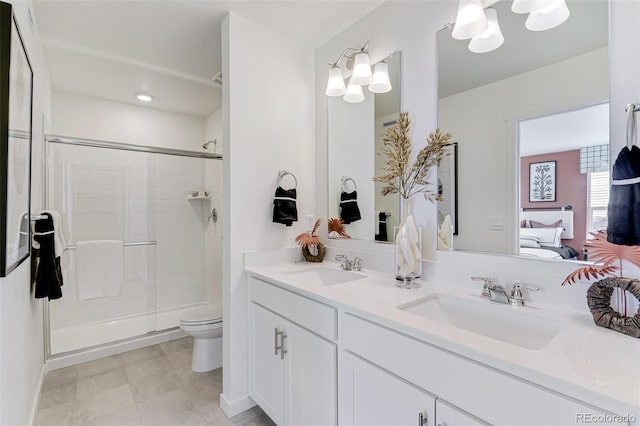 bathroom with an enclosed shower, vanity, tile patterned flooring, and toilet