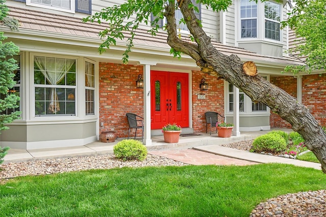 1583 Sunset Ridge Rd, Highlands Ranch, CO 80126 - entrance to property featuring a porch and brick siding