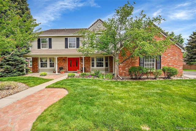 1583 Sunset Ridge Rd, Highlands Ranch, CO 80126 - traditional-style house with a front lawn and brick siding