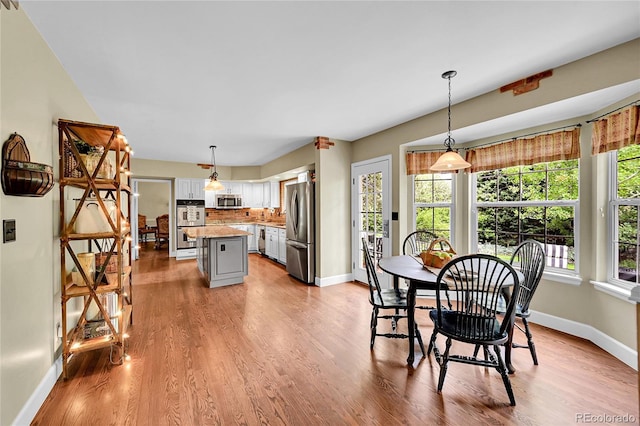 1583 Sunset Ridge Rd, Highlands Ranch, CO 80126 - dining space with baseboards and wood finished floors