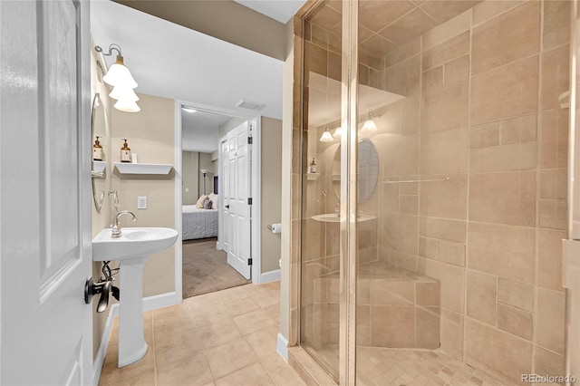1583 Sunset Ridge Rd, Highlands Ranch, CO 80126 - ensuite bathroom featuring a stall shower, tile patterned flooring, and baseboards