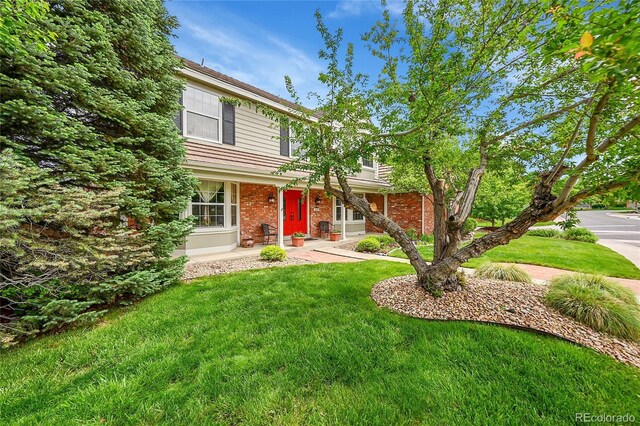 1583 Sunset Ridge Rd, Highlands Ranch, CO 80126 - view of front of property featuring a front lawn and brick siding