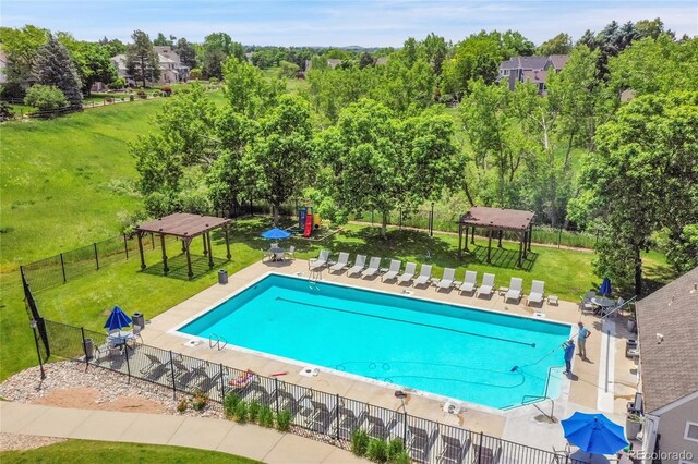 1583 Sunset Ridge Rd, Highlands Ranch, CO 80126 - community pool featuring a gazebo, a patio, and view of wooded area