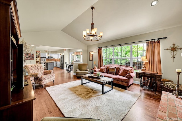1583 Sunset Ridge Rd, Highlands Ranch, CO 80126 - living area featuring a chandelier, wood finished floors, recessed lighting, and high vaulted ceiling