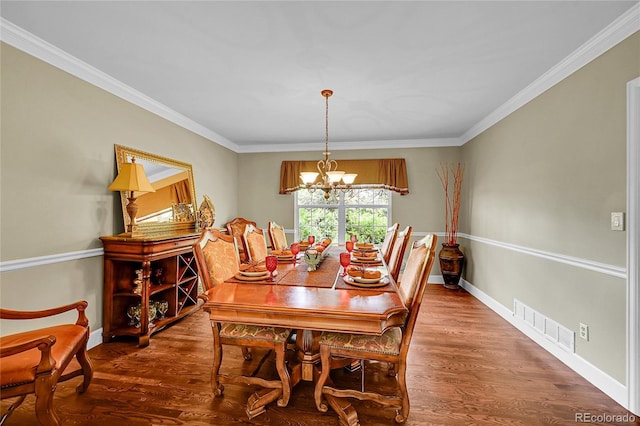 1583 Sunset Ridge Rd, Highlands Ranch, CO 80126 - dining area with a chandelier, wood finished floors, crown molding, and baseboards