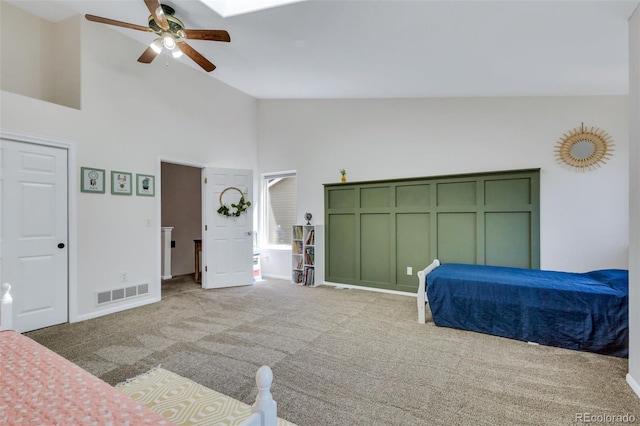 unfurnished bedroom featuring high vaulted ceiling, light colored carpet, baseboards, and ceiling fan