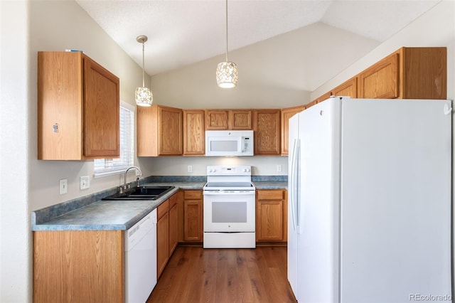 kitchen with pendant lighting, dark wood finished floors, vaulted ceiling, a sink, and white appliances