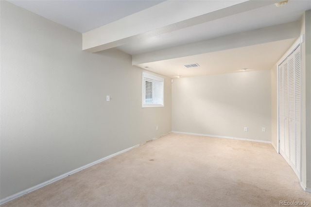 interior space featuring carpet, visible vents, and baseboards