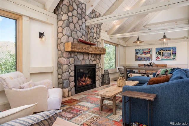 living room featuring wood ceiling, high vaulted ceiling, a stone fireplace, beamed ceiling, and hardwood / wood-style flooring