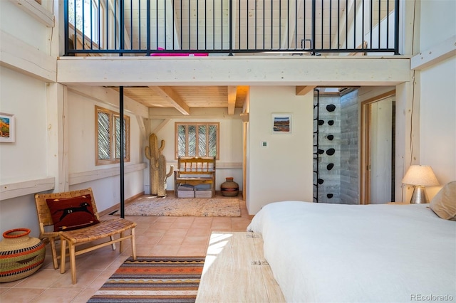 tiled bedroom with beam ceiling