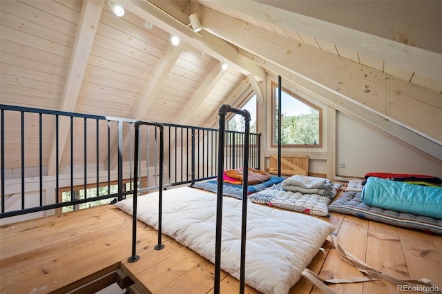 unfurnished bedroom with wood-type flooring, wood ceiling, and lofted ceiling with beams