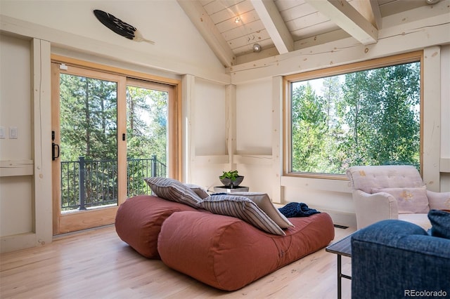 interior space with wood ceiling, lofted ceiling with beams, and hardwood / wood-style flooring