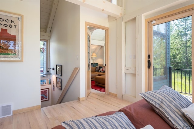 doorway with hardwood / wood-style flooring