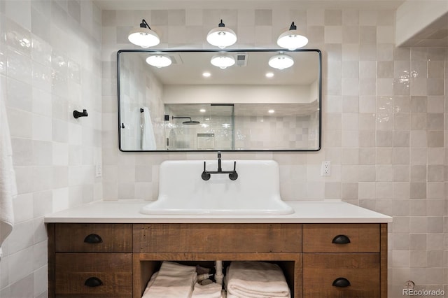 bathroom with tile walls, backsplash, and vanity