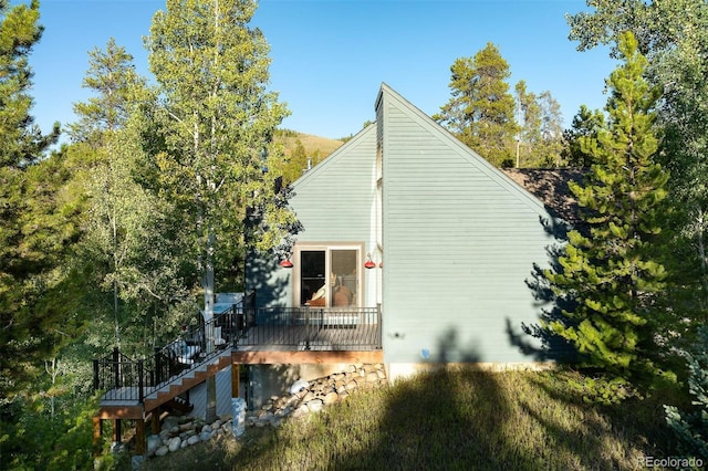 view of side of property featuring a deck