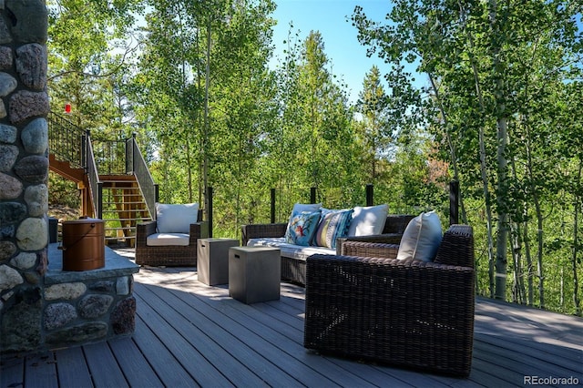 wooden terrace featuring outdoor lounge area