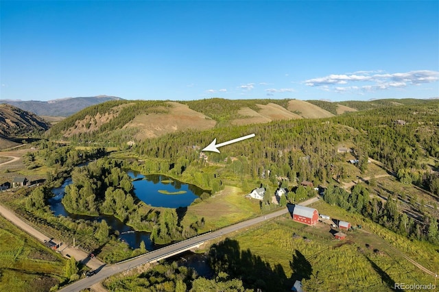 bird's eye view with a water and mountain view