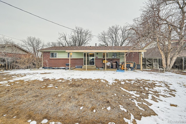 view of front of house featuring brick siding