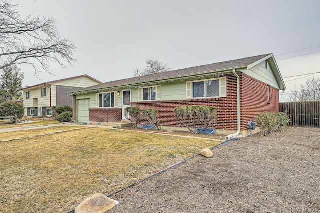 view of front facade featuring a garage, brick siding, concrete driveway, fence, and a front yard