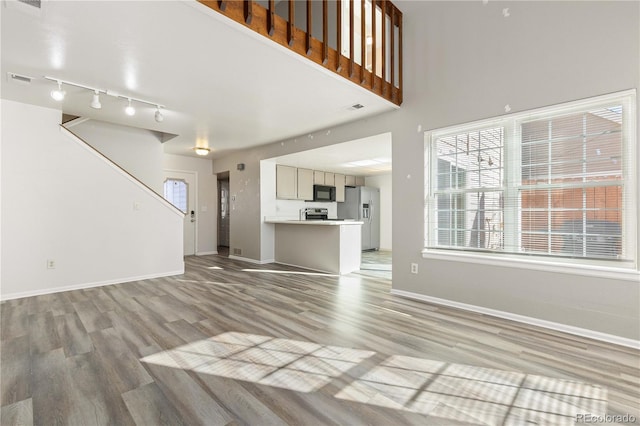 unfurnished living room featuring light hardwood / wood-style floors