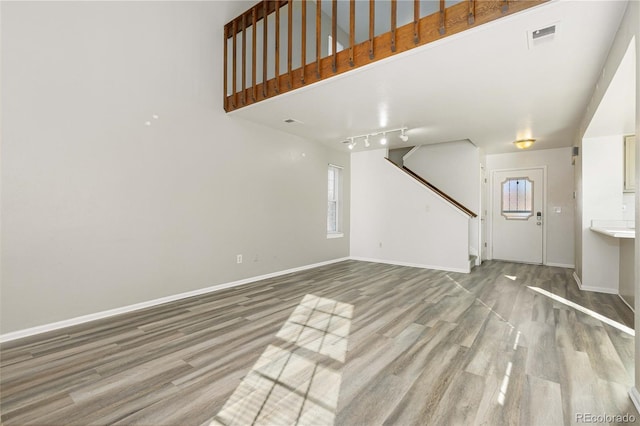 unfurnished living room featuring light hardwood / wood-style floors