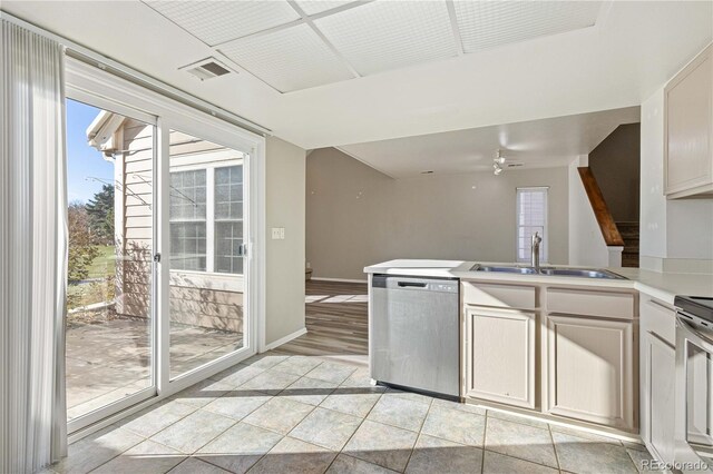 kitchen with dishwasher, white cabinets, sink, ceiling fan, and light hardwood / wood-style floors