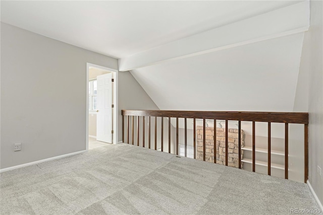 bonus room featuring light carpet and vaulted ceiling