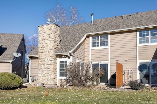 rear view of house with a lawn