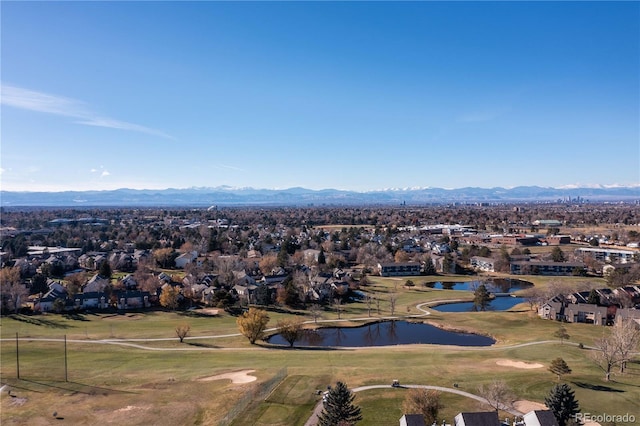 birds eye view of property with a water and mountain view