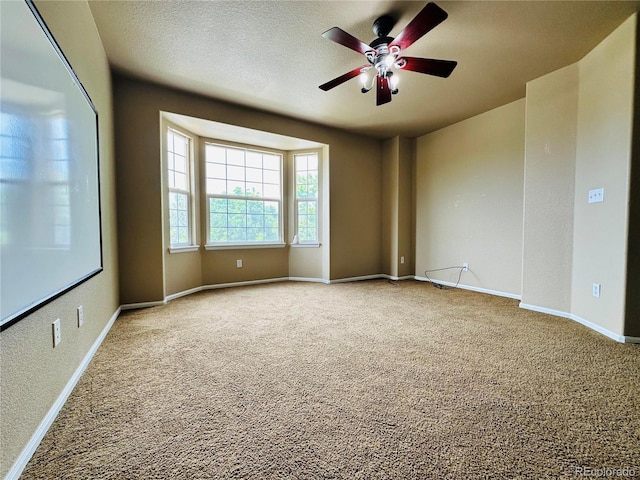 6102 S Yampa St, Aurora, CO 80016 - carpeted empty room featuring a ceiling fan and a textured ceiling