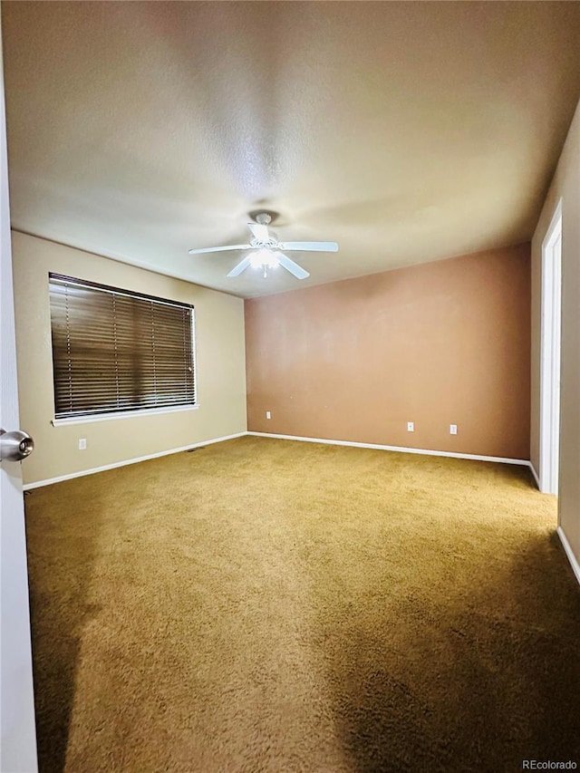 6102 S Yampa St, Aurora, CO 80016 - empty room featuring carpet floors and a ceiling fan