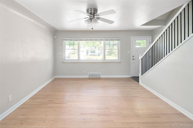 1856 S Monroe St, Denver, CO 80210 - entrance foyer featuring stairs, light wood-type flooring, and a ceiling fan